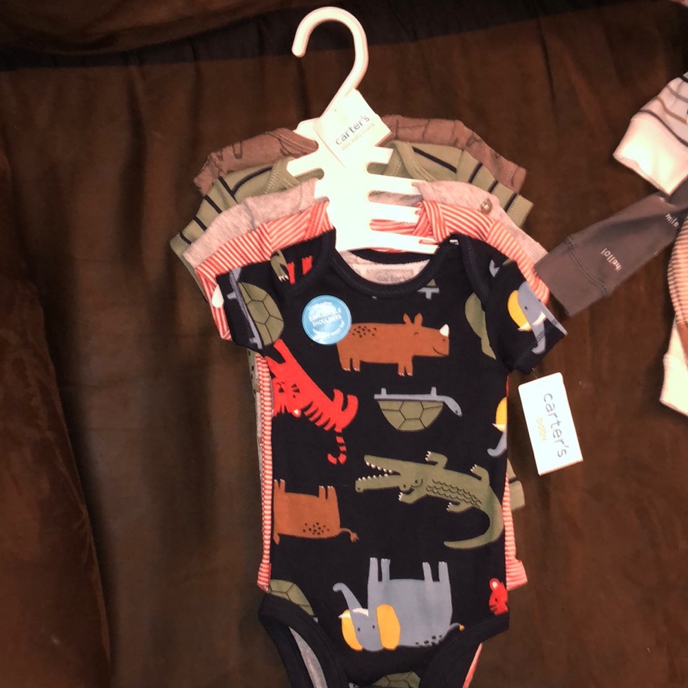 Brand new never worn Carter’s onesies